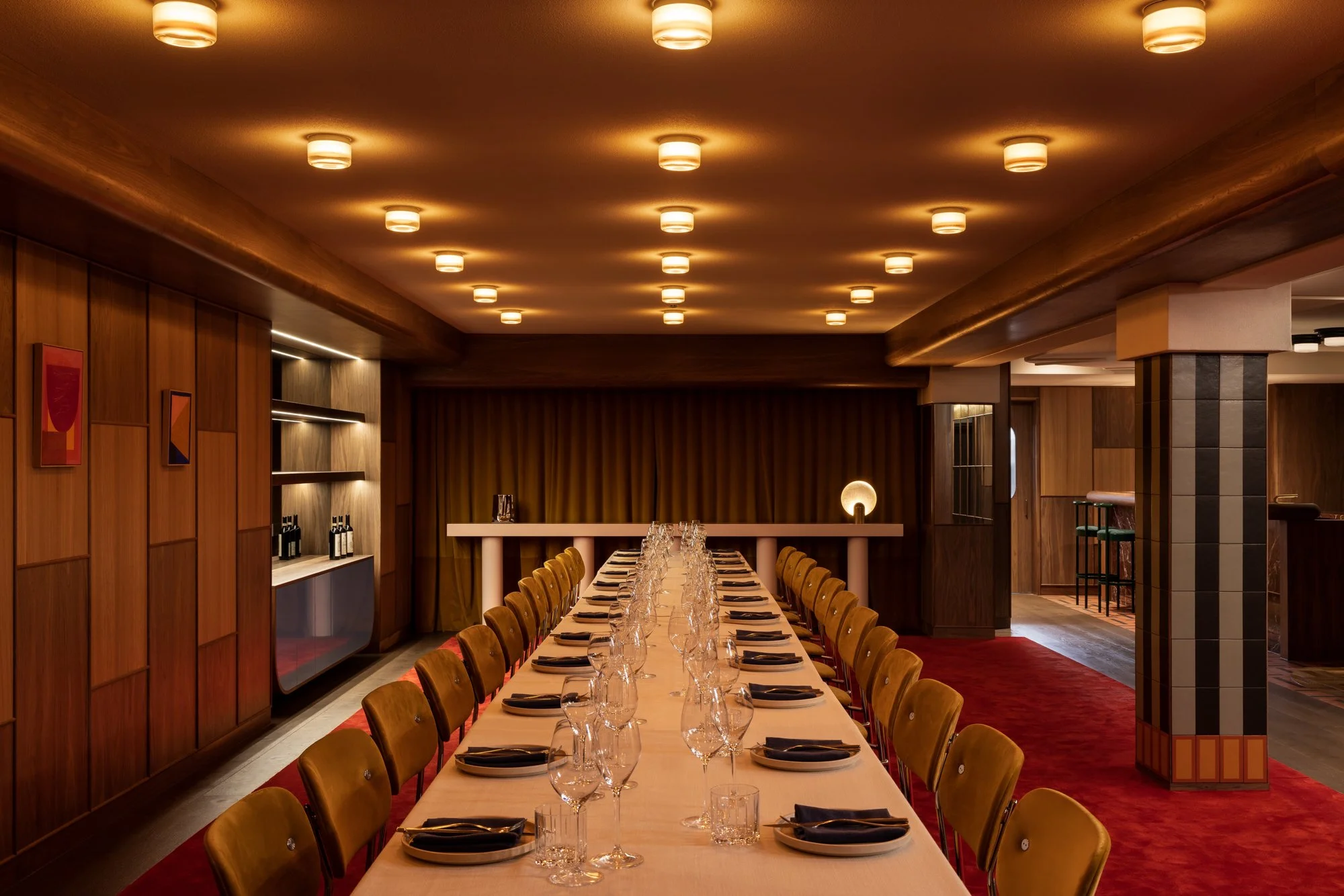 The long table laid at Fugazzi Basement, glasses set and ready